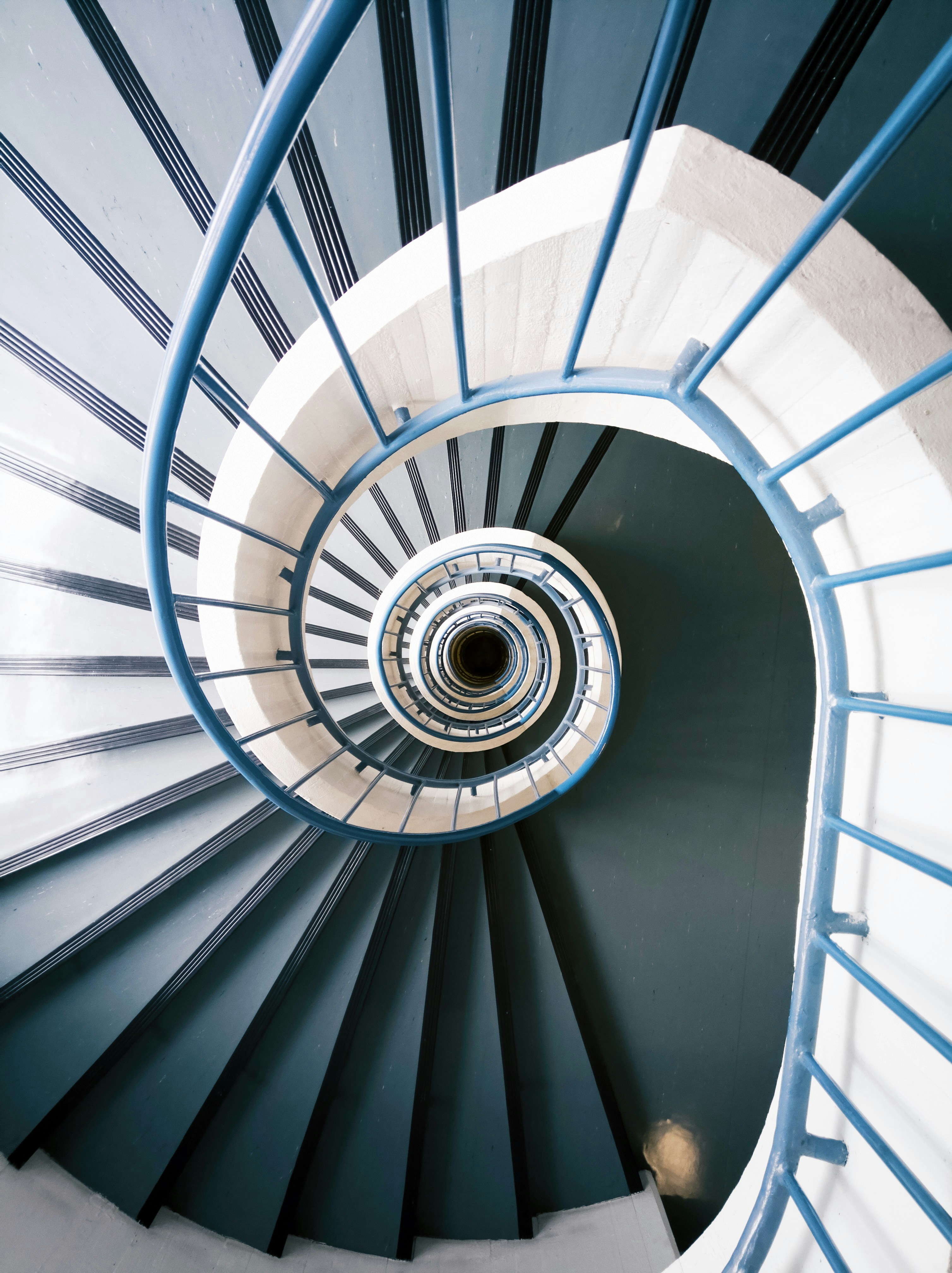empty twirl stairs photo Free Handrail Image on Unsplash