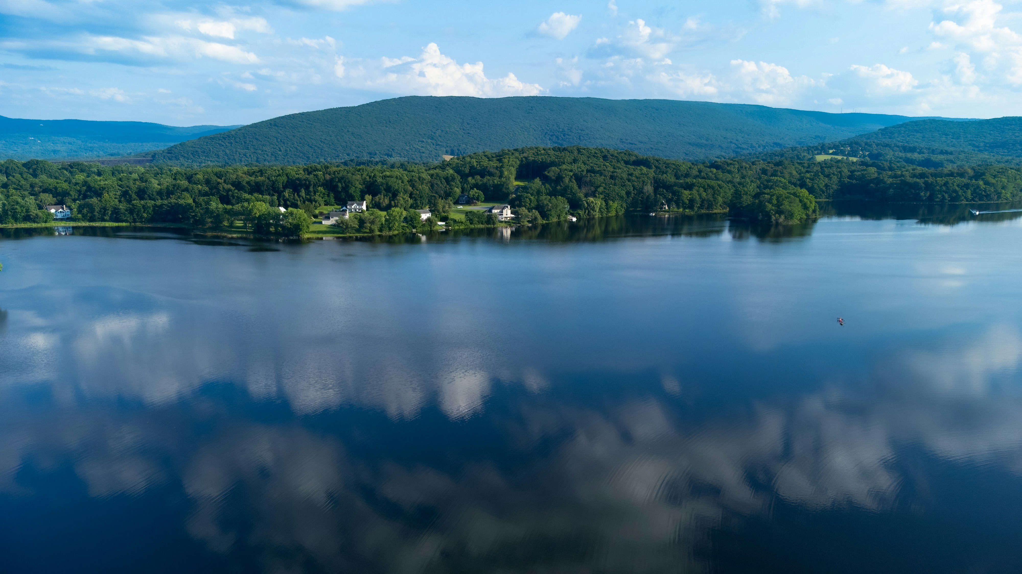 A large body of water surrounded by mountains photo Free Beaverdam