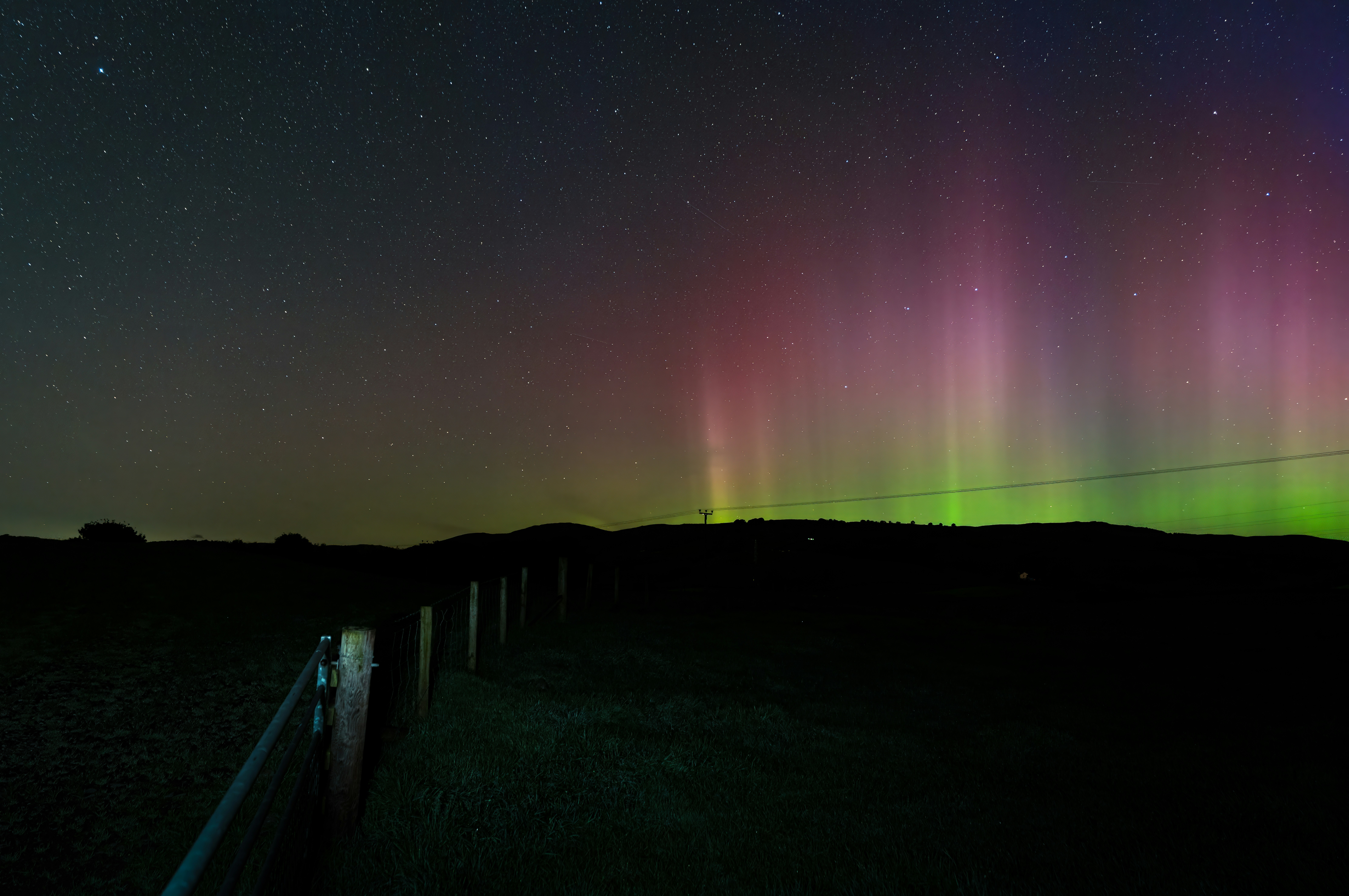 A green and purple light is shining in the sky photo Free Uk Image on