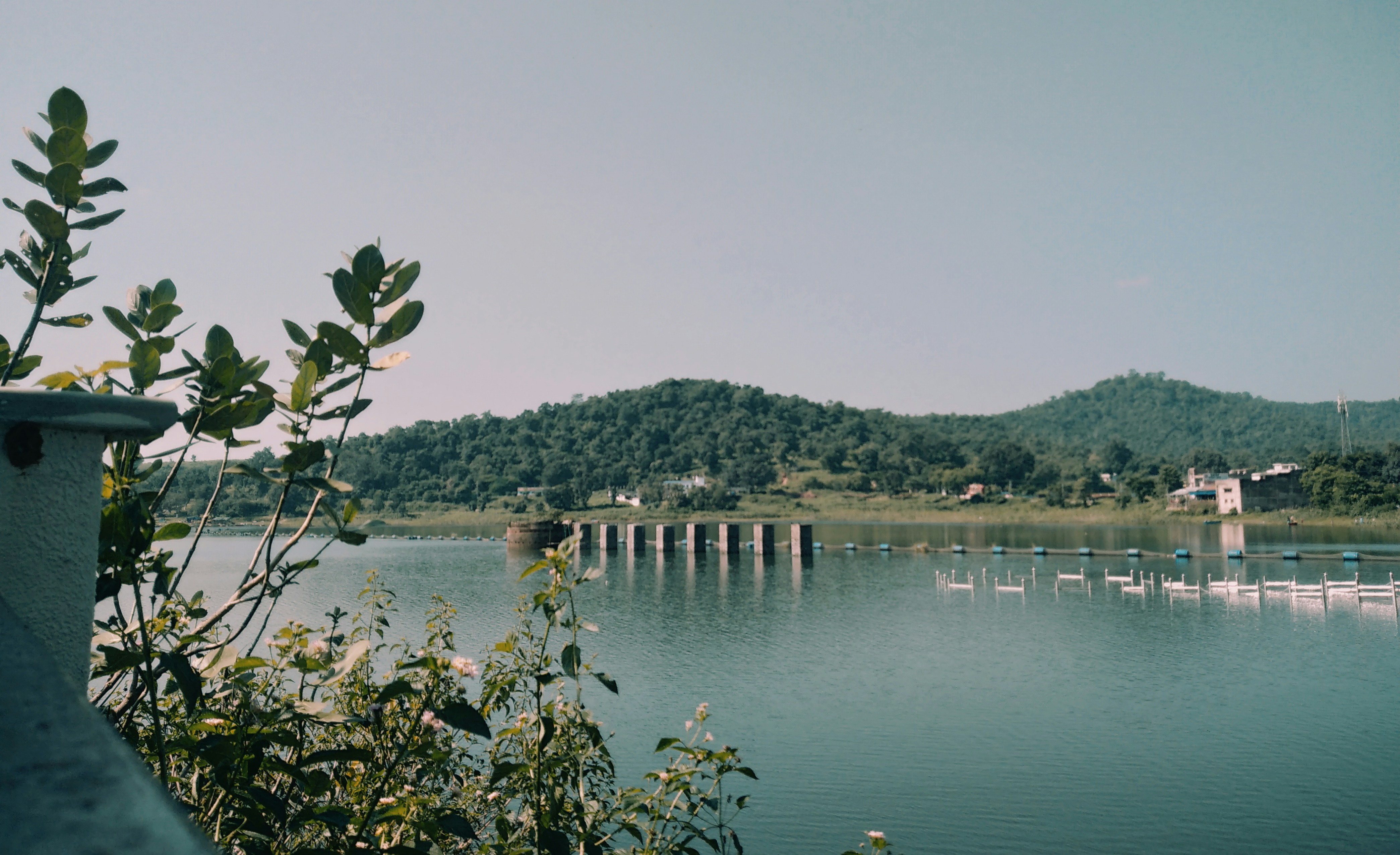 A body of water with a bridge in the background photo Free Jharkhand