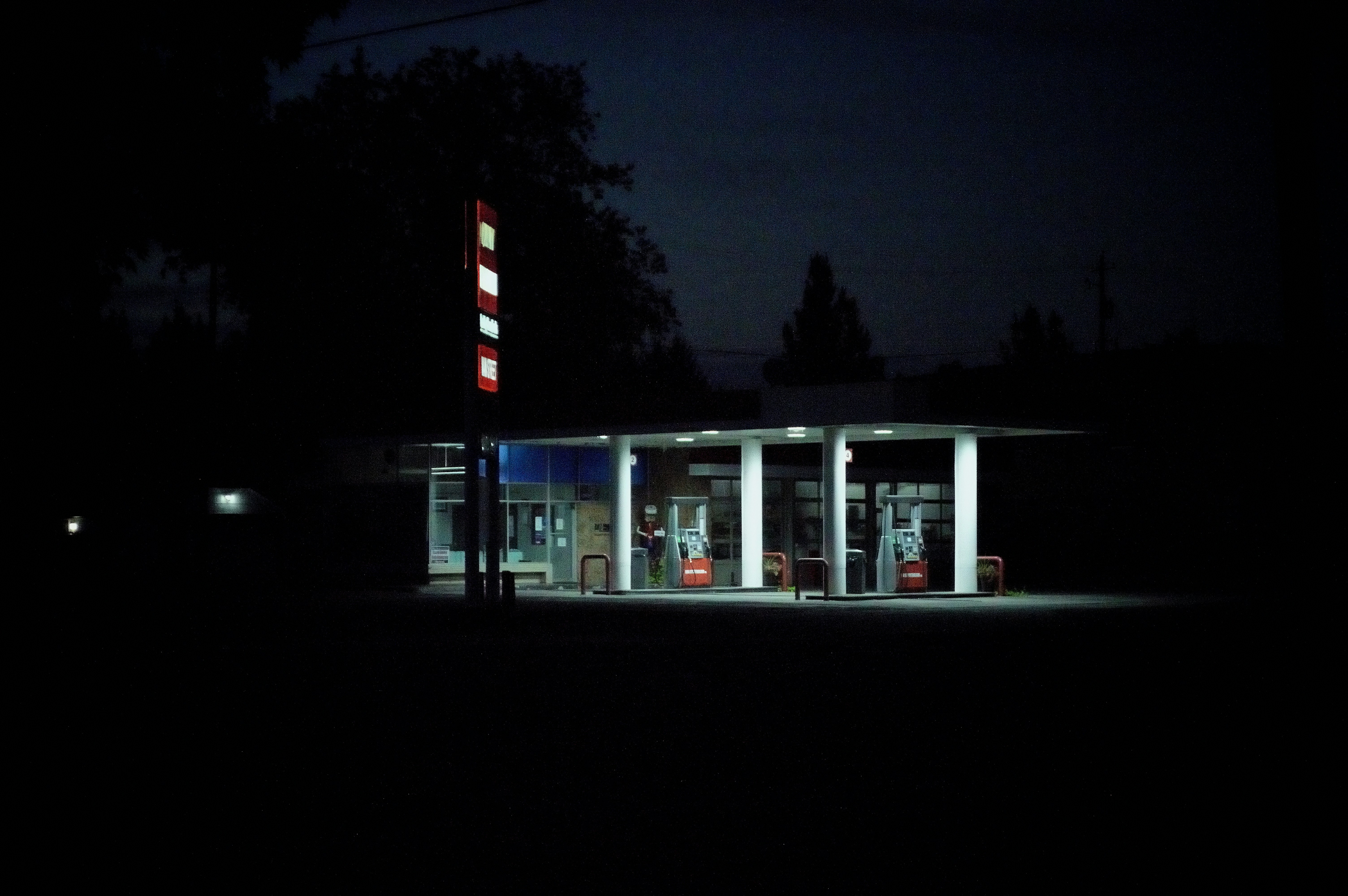 A gas station at night with the lights on photo Free Walla walla