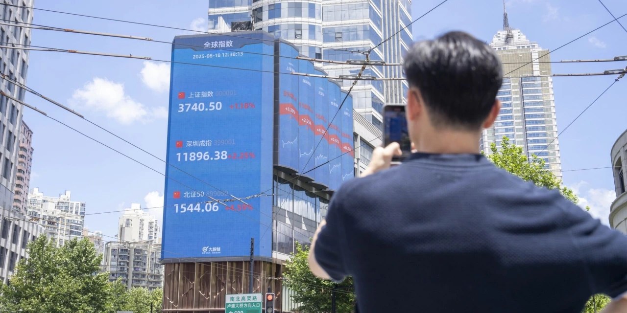 China Stock Rally Sends Shanghai Benchmark to Decade High WSJ