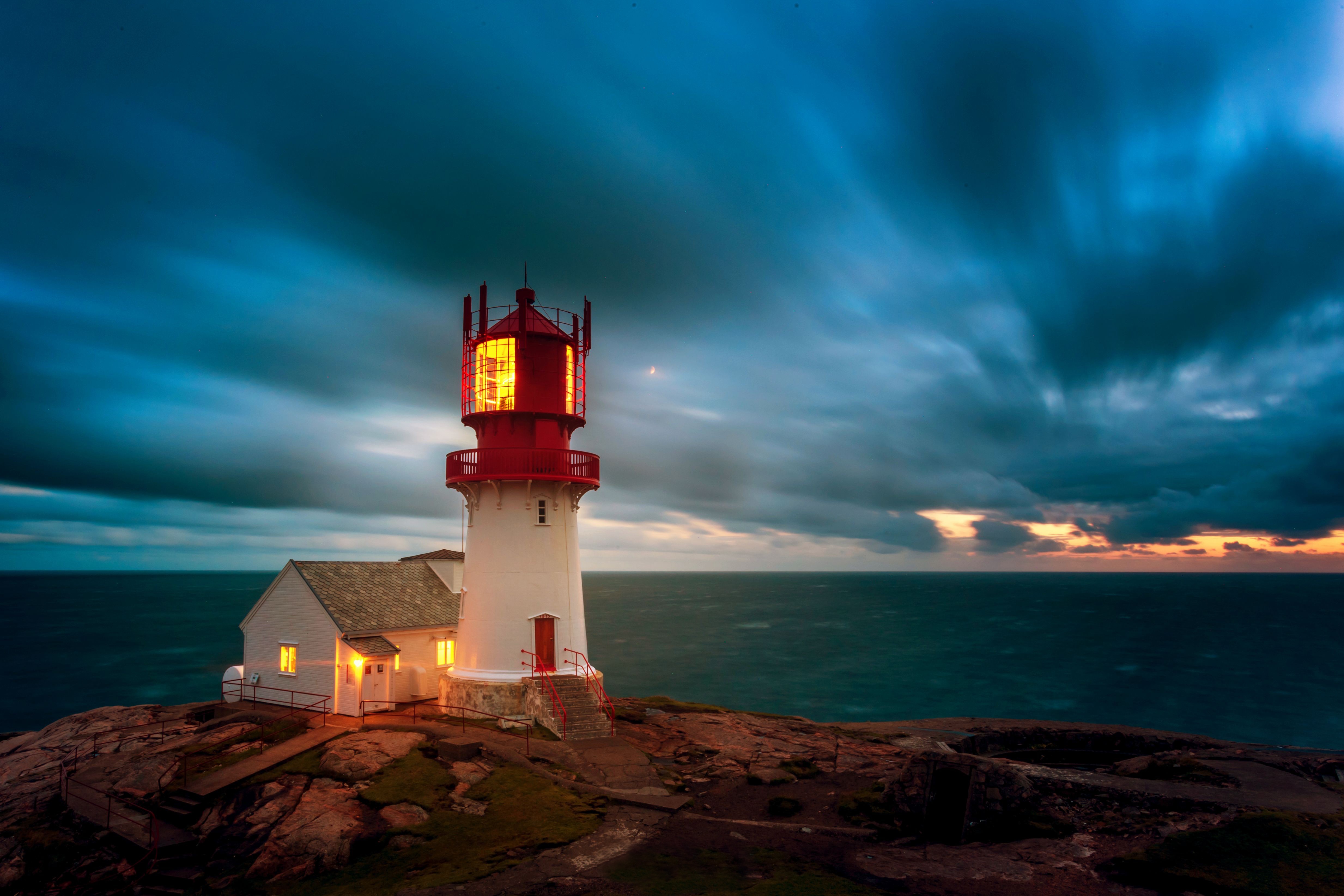 Dark Clouds over Lighthouse 4k Ultra HD Wallpaper