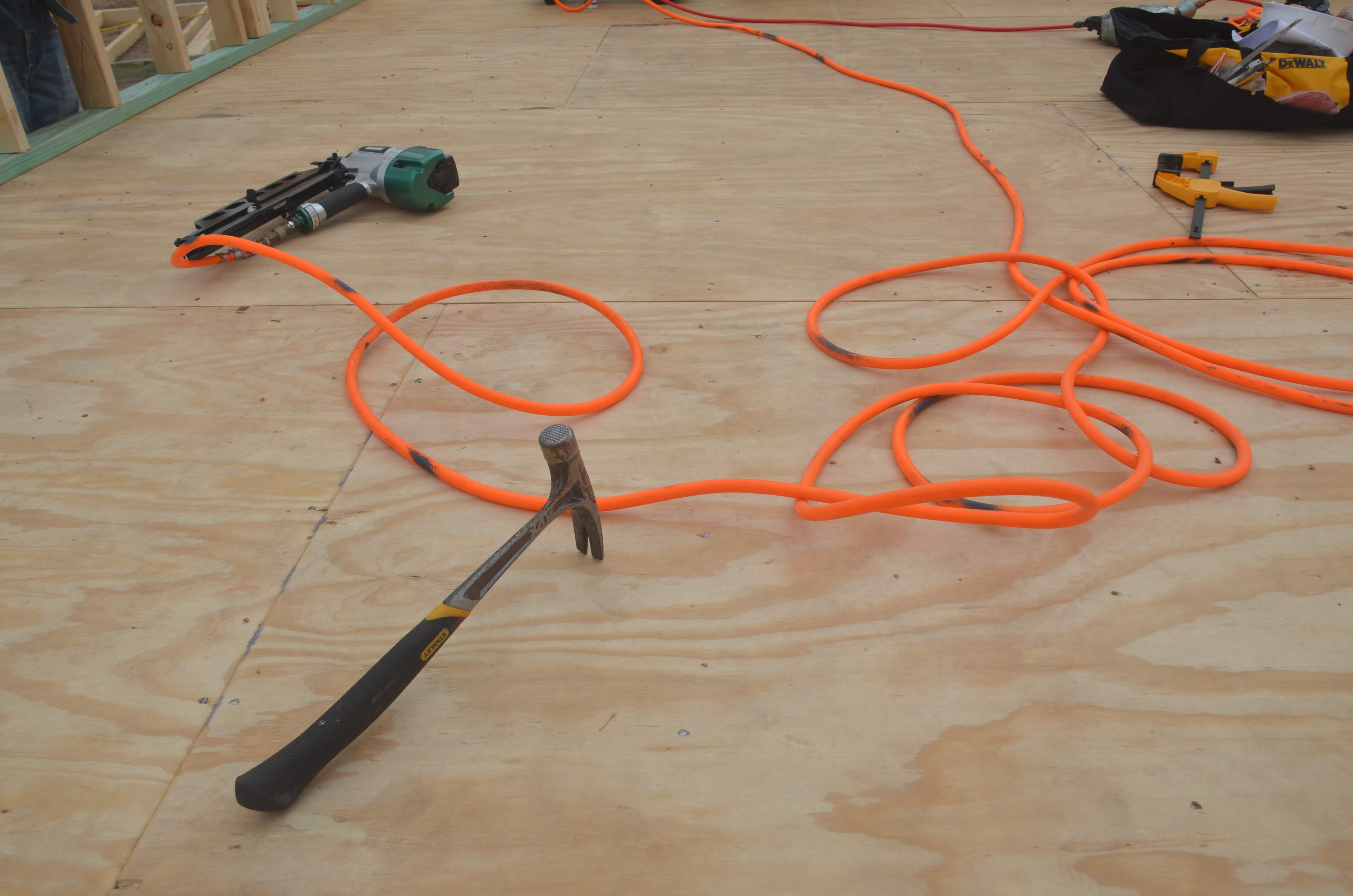 Nail gun, air hose and hammer. Pics4Learning