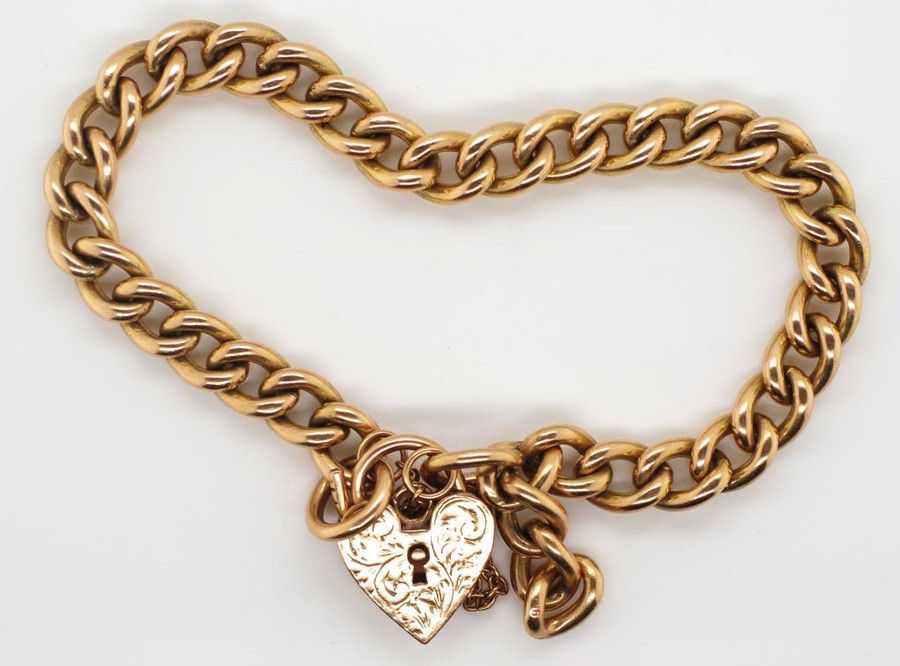 9ct gold heart padlock and curb link bracelet marked 9ct to