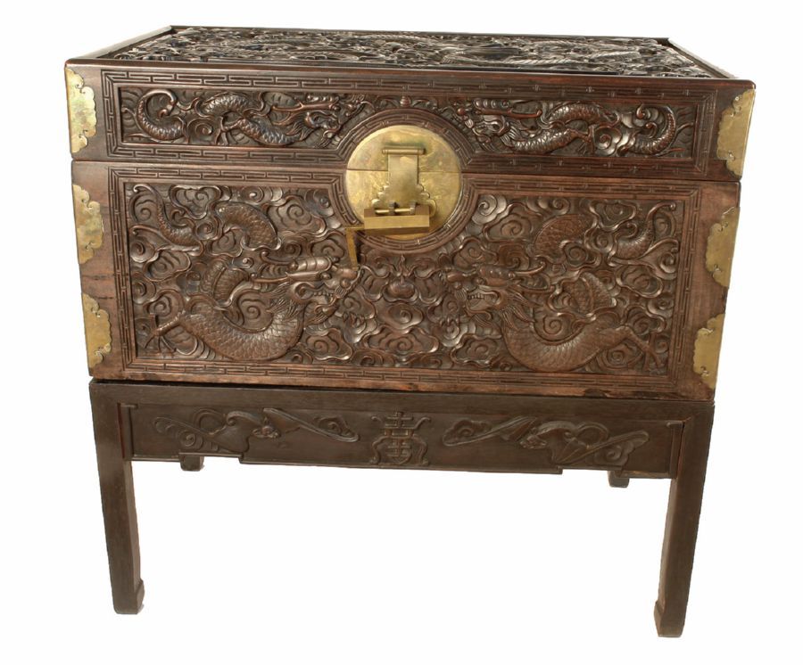 A vintage Chinese well carved blackwood hinged lid box on stand