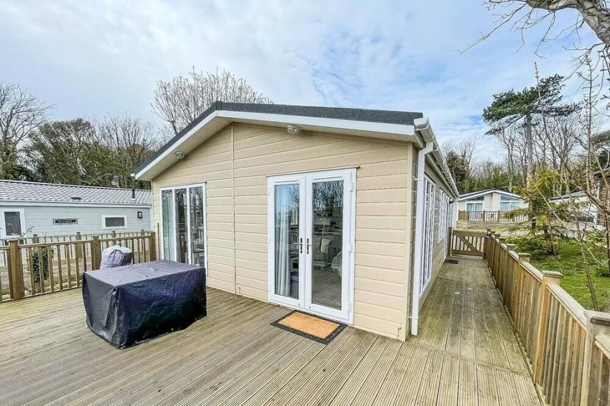 Lodge with decking and sea views at Azure Seas Park in Suffolk ref