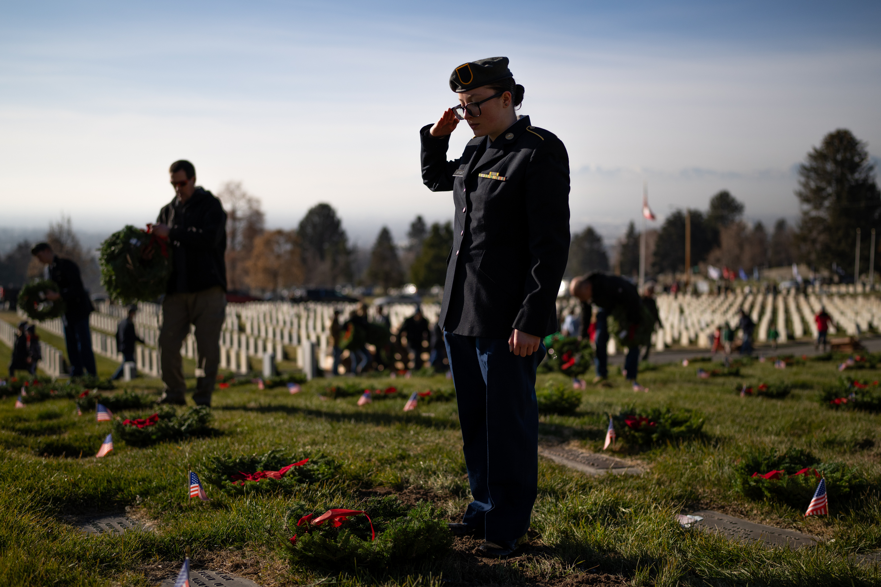 Hundreds gather to remember and honor veterans by placing wreaths at