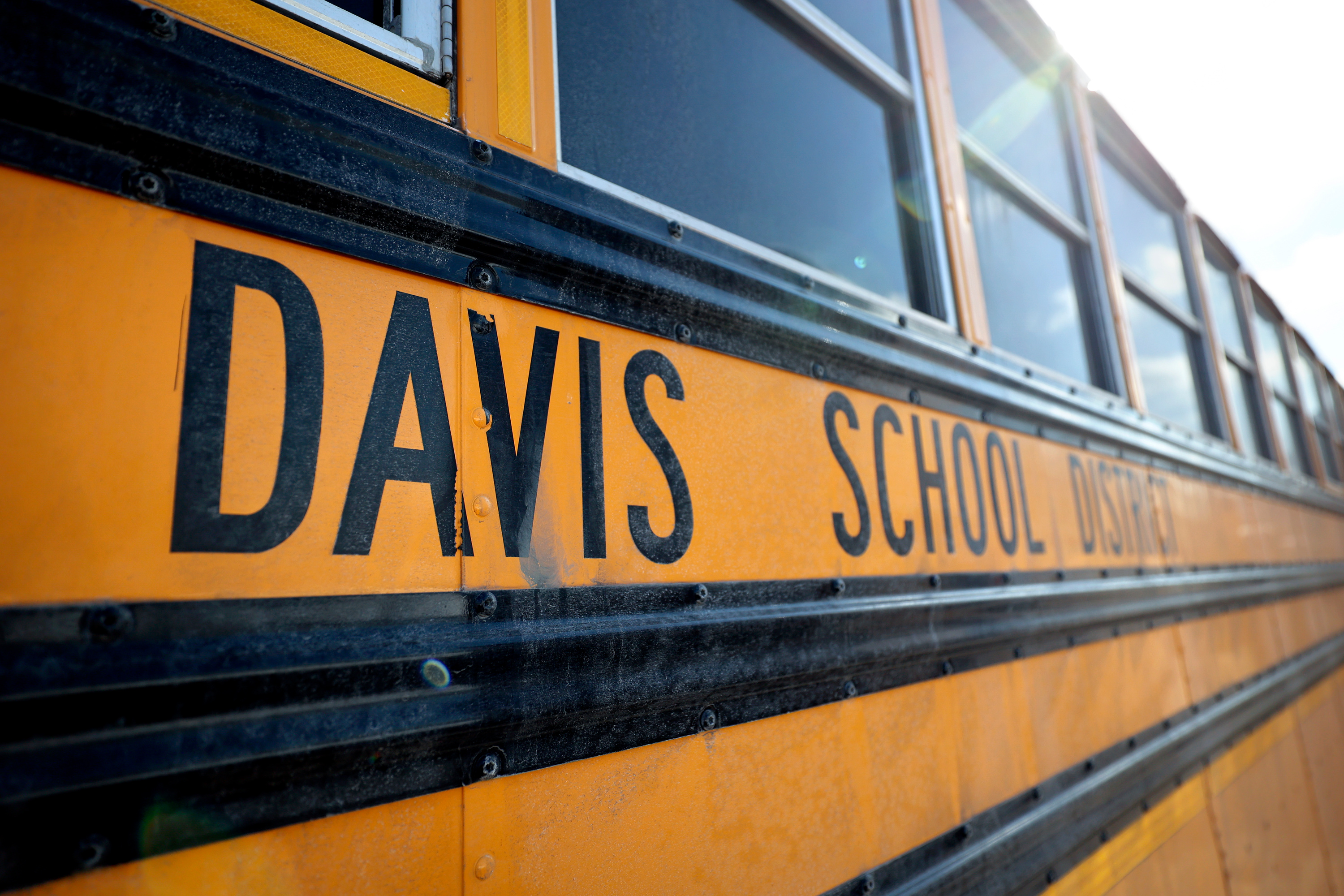 Davis District bus driver arrested at school, accused of trying to meet