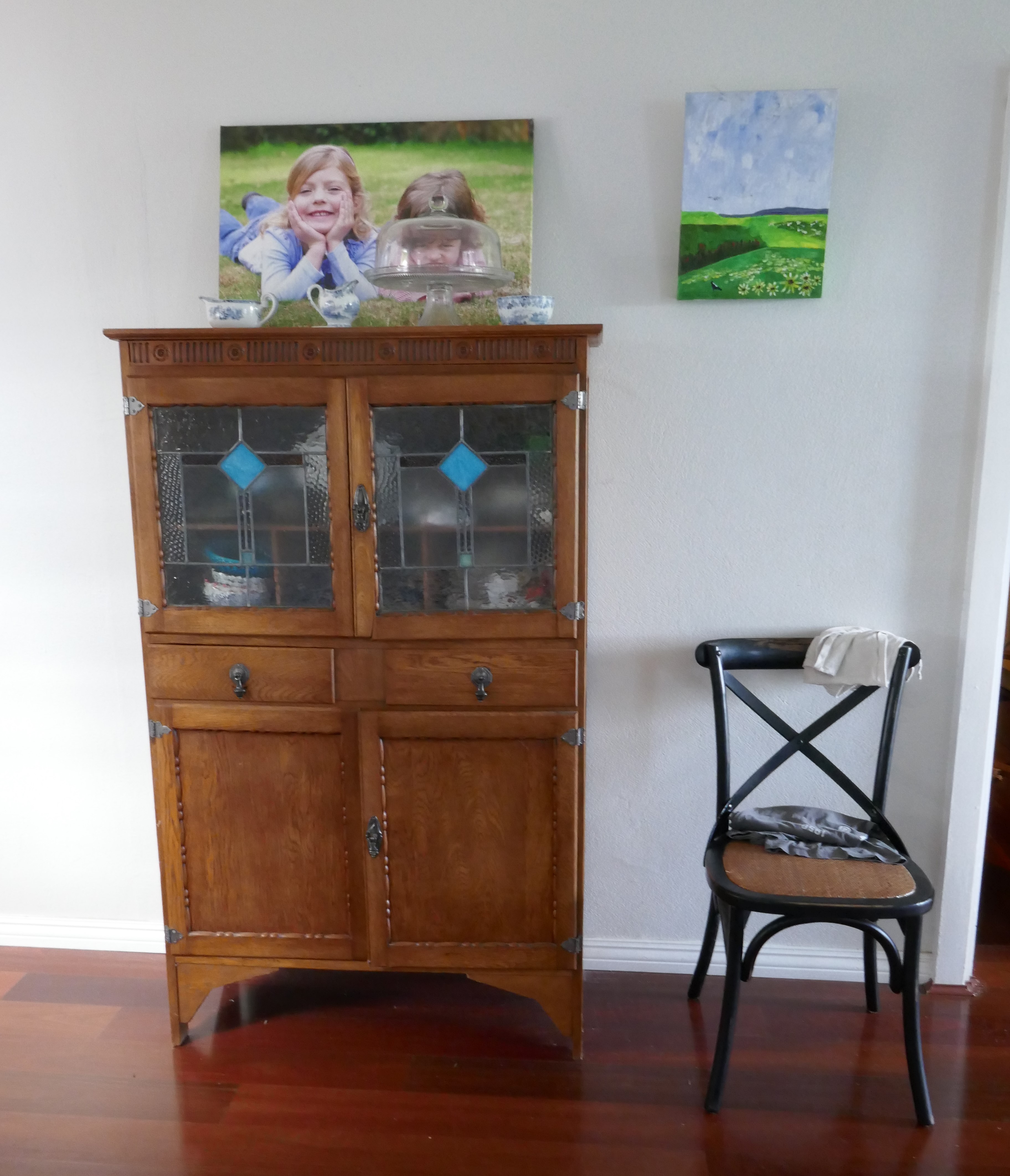 An antique cupboard with glass doors / myLot