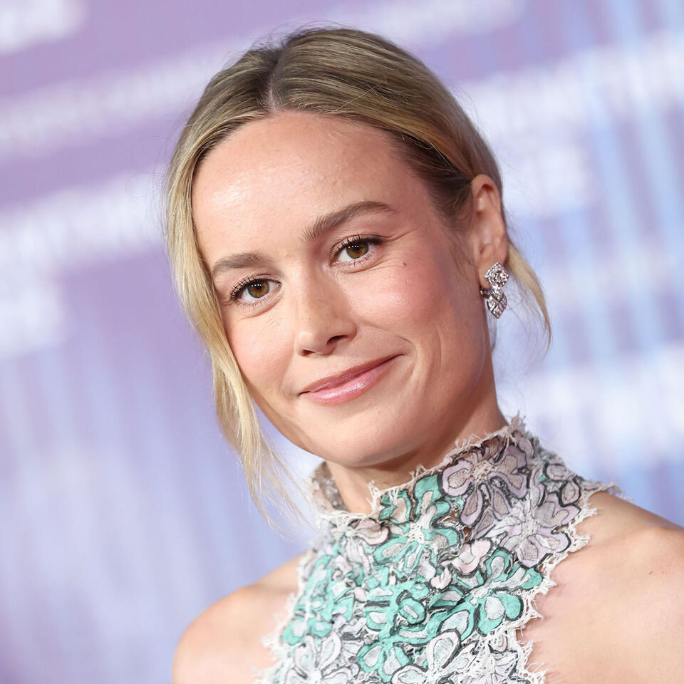 Brie Larson Stuns Wearing A Versace Mini Skirt And A Crisp ButtonDown
