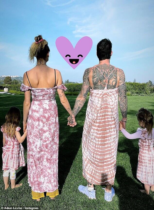 Adam Levine wears a dress in a sweet family photo to match wife Behati