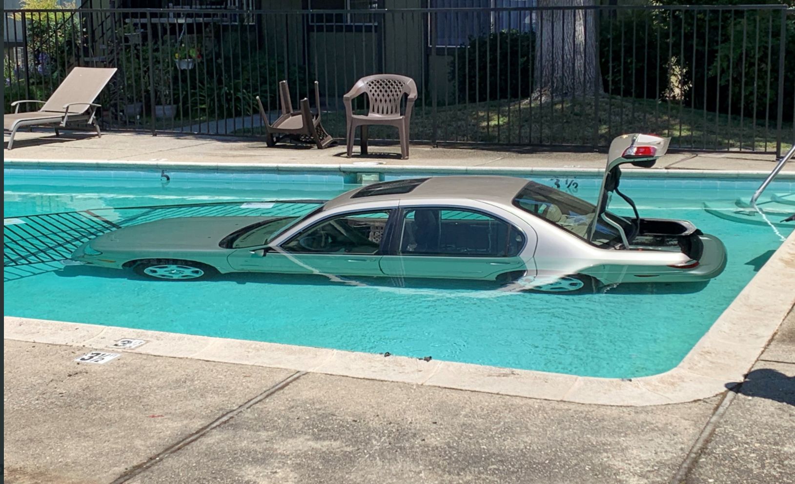 Day Around the Bay Car Lands In San Jose Swimming Pool