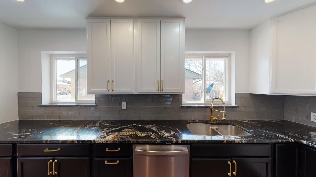 Classic brick Montclair home with covered patio & fenced yard