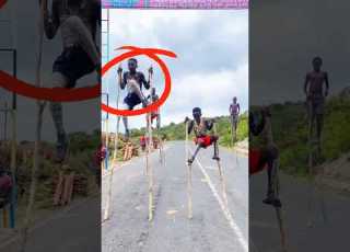 Walking 10 Feet Tall African Stilt Walkers Shorts