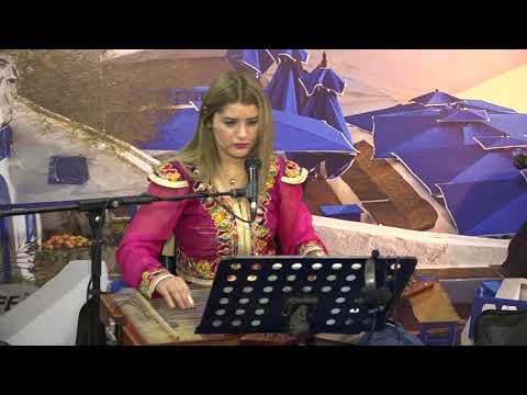 عازفة القانون والفنانة التونسية ملاك كوشتوبان خلال معرض الشرق الاوسط للسياحة اربيل