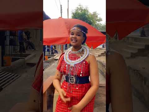 Beautiful Maasai Lady Enjoying A Song Mobetto