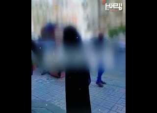  A Veiled Girl Chases Her Mother In The Street And Hits Her In Front Of People