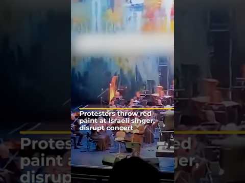Protesters Throw Red Paint At Israeli Singer Disrupt Concert