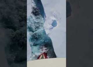 Ice Breaker Ship Clearing Way For A Container Ship