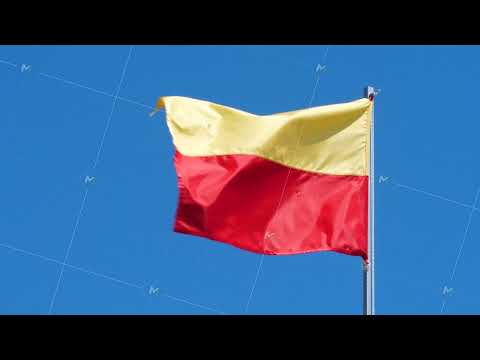 Yellow And Red Flag Wave In Wind