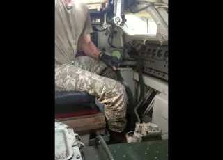 Soldier Driving Military Tank