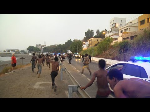 155 مهاجرا إفريقيا يعبرون حدود سبتة الإسبانية من شمال المغرب AFP