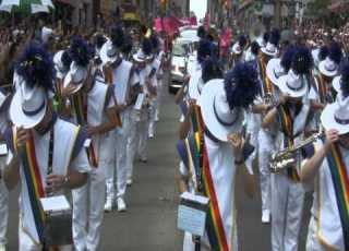 The Lesbian Gay Big Apple Corps Performs At The 2011 Toronto Pride Parade