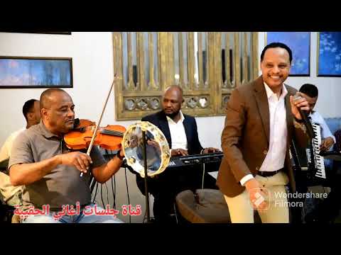 زهـرة السوسن والنجم اللامع الفنان الأستاذ حسـن محجـوب