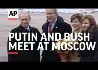 Putin And Bush Meet At Moscow Airport As US President Heads To Asia