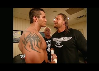 Randy Orton Celebrates His Victory With Evolution RAW 07 26 2004