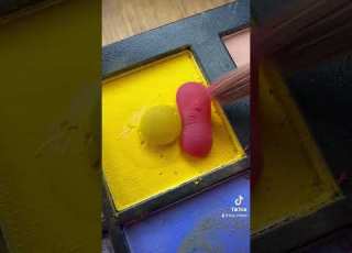 Mixing A Pink Droplet With A Yellow Droplet