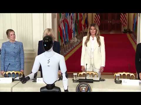 Melania Trump Walks Out With Robot At Summit