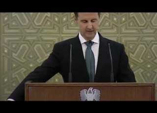 بشار الأسد يؤدي اليمين الدستورية و يقاطع تصفيق الحضور بنكتة عن الأمريكيين و الأتراك
