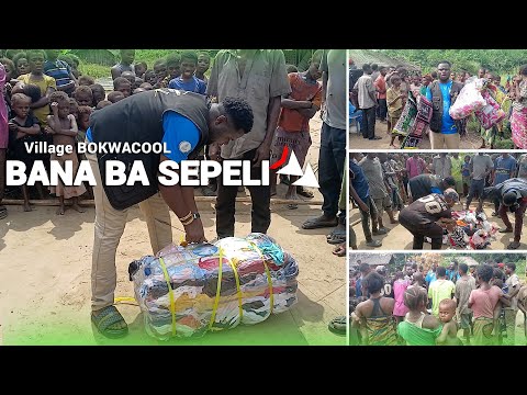 BACK TO THE VILLAGE CHECK OUT THE CHILDREN AND MOTHERS RECEIVING THE CLOTHES AS THEY SENT WITH H