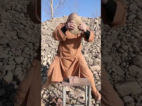 Kung Fu Monk Performing Shaolin Hard Qigong