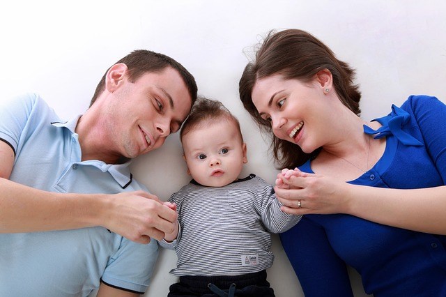 baby is playing with parents