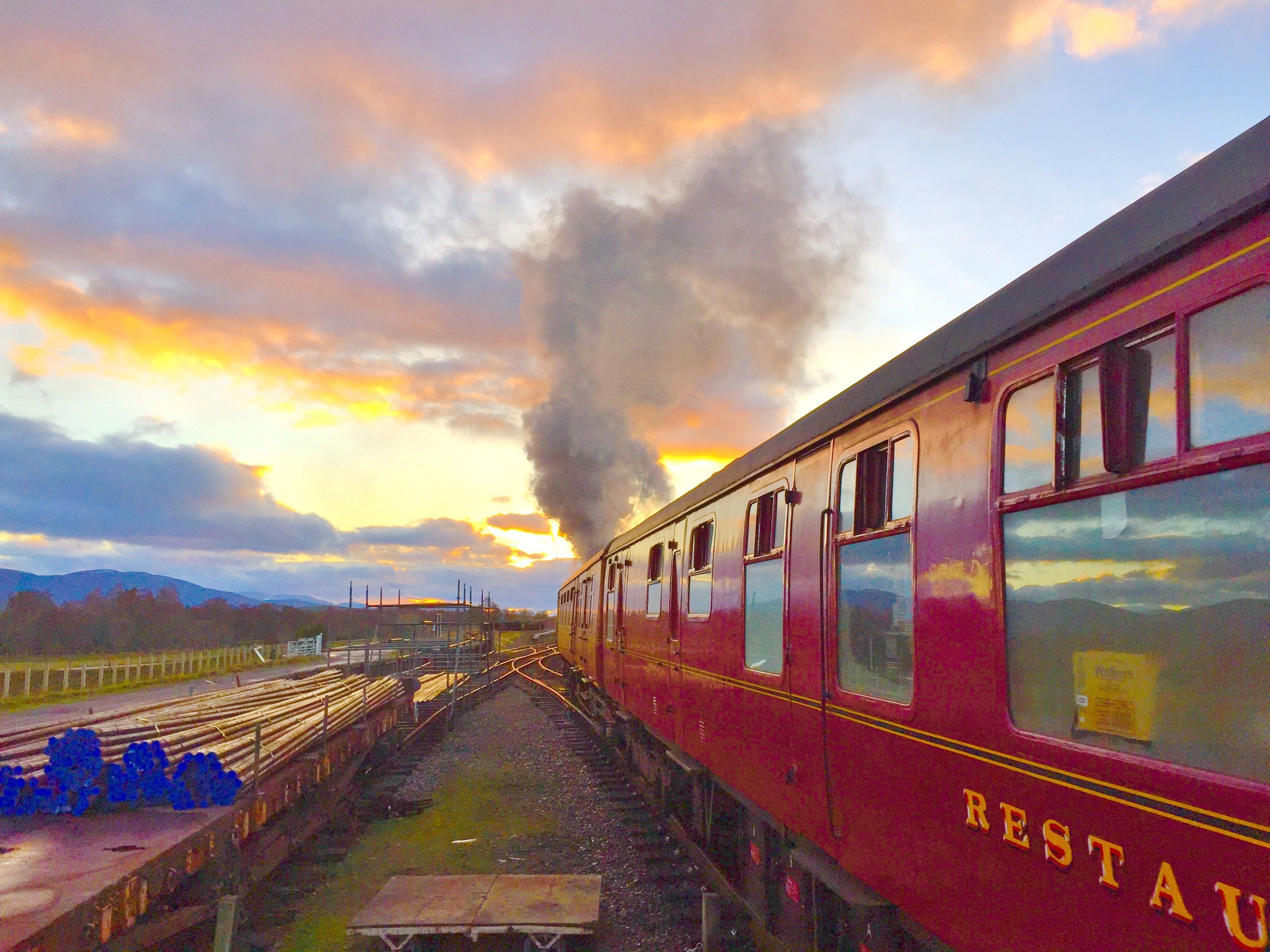 Old Strathspey steam train travelling towards sunset, Cairngorms National Park, Scotland