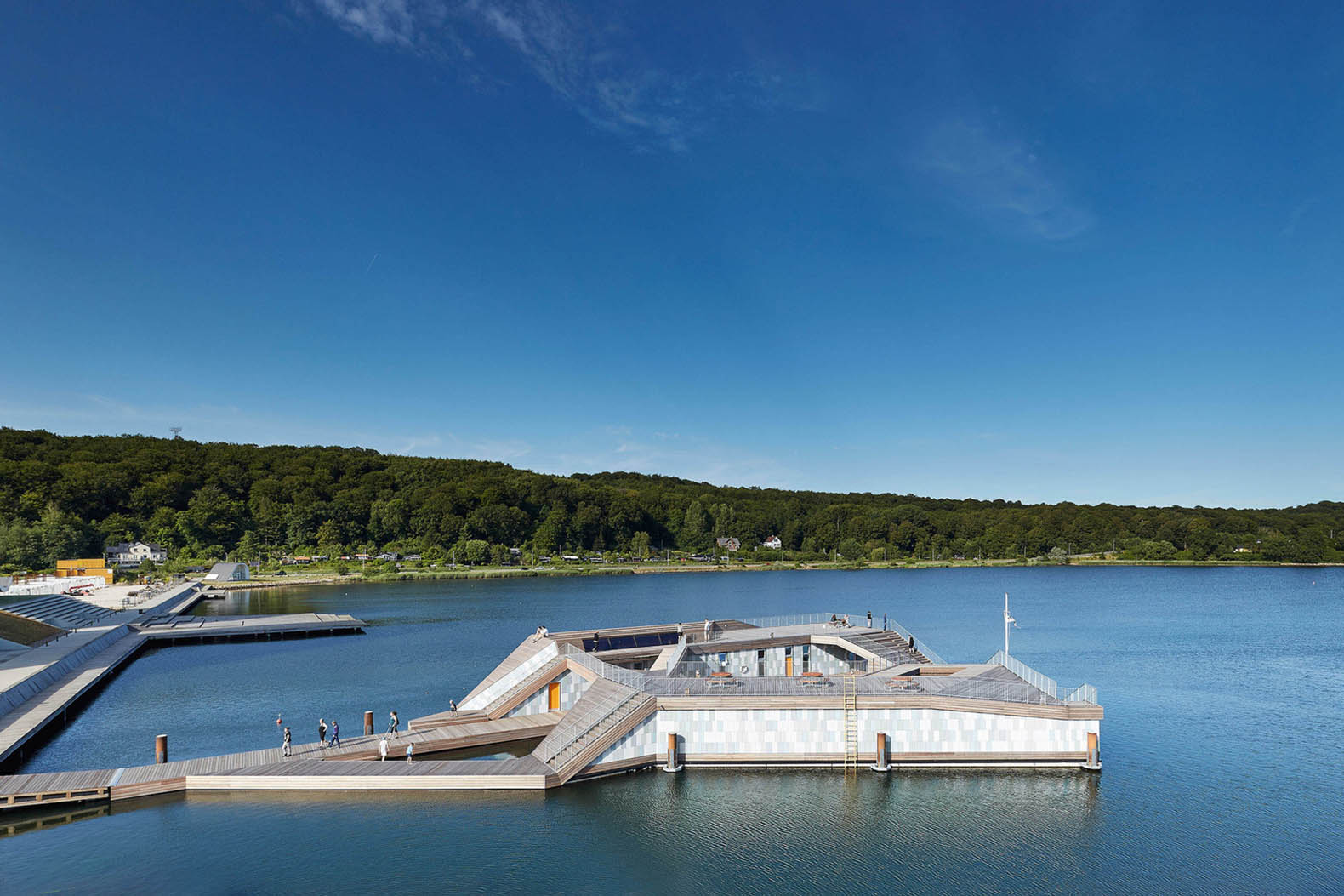 Sculptural floating kayak club doubles as a beautiful community space