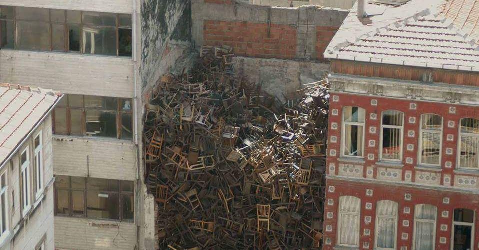 Why Are There 1550 Chairs Stacked Between These Buildings? InMediately