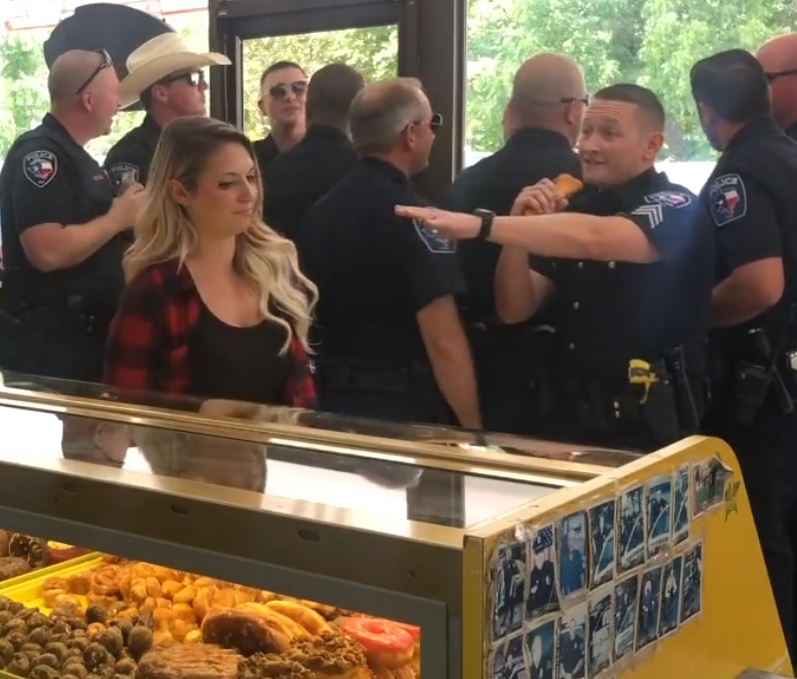 Police Officer Taps Her Shoulder And When She Spins, All The Cops Jump