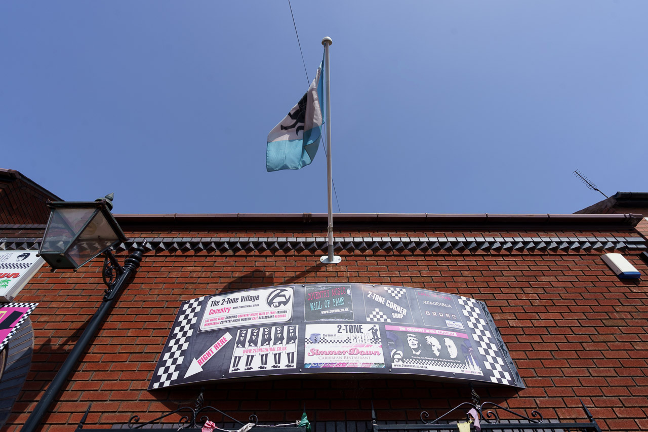 A flag flying from the outside wall of The Coventry Music Museum