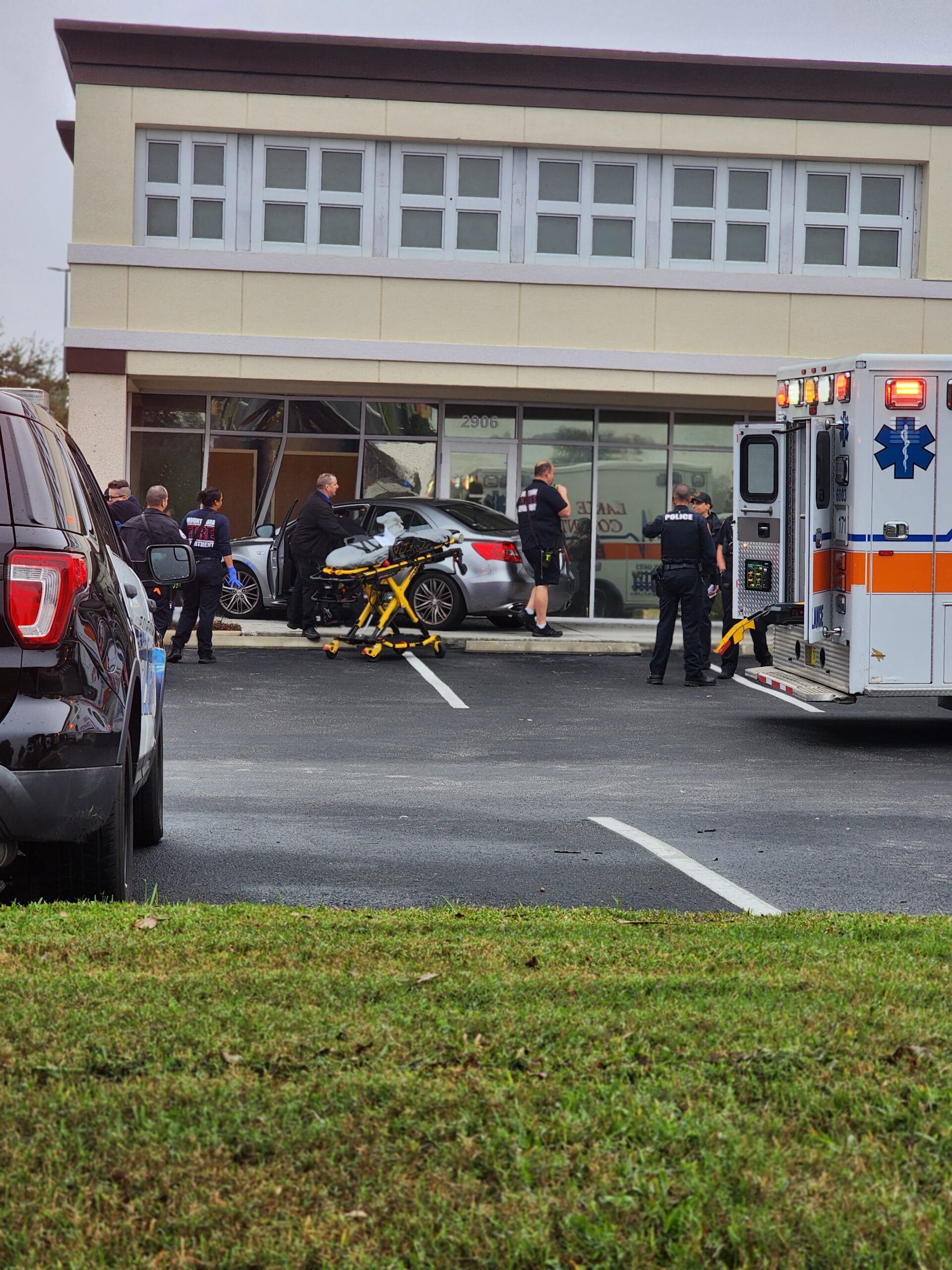 BREAKING NEWS Car Drives Into Eustis Building Inside Lake