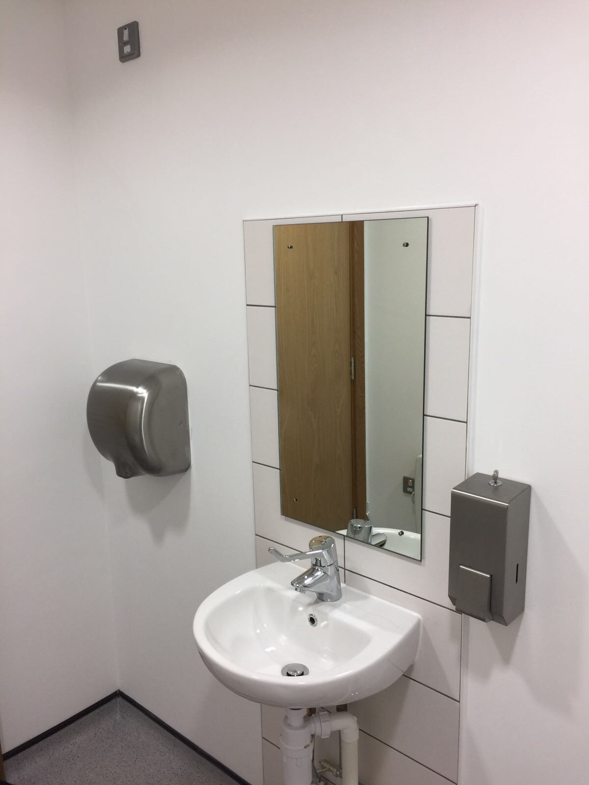 Installation of hand dryers and soap dispensers Integrity Facilities