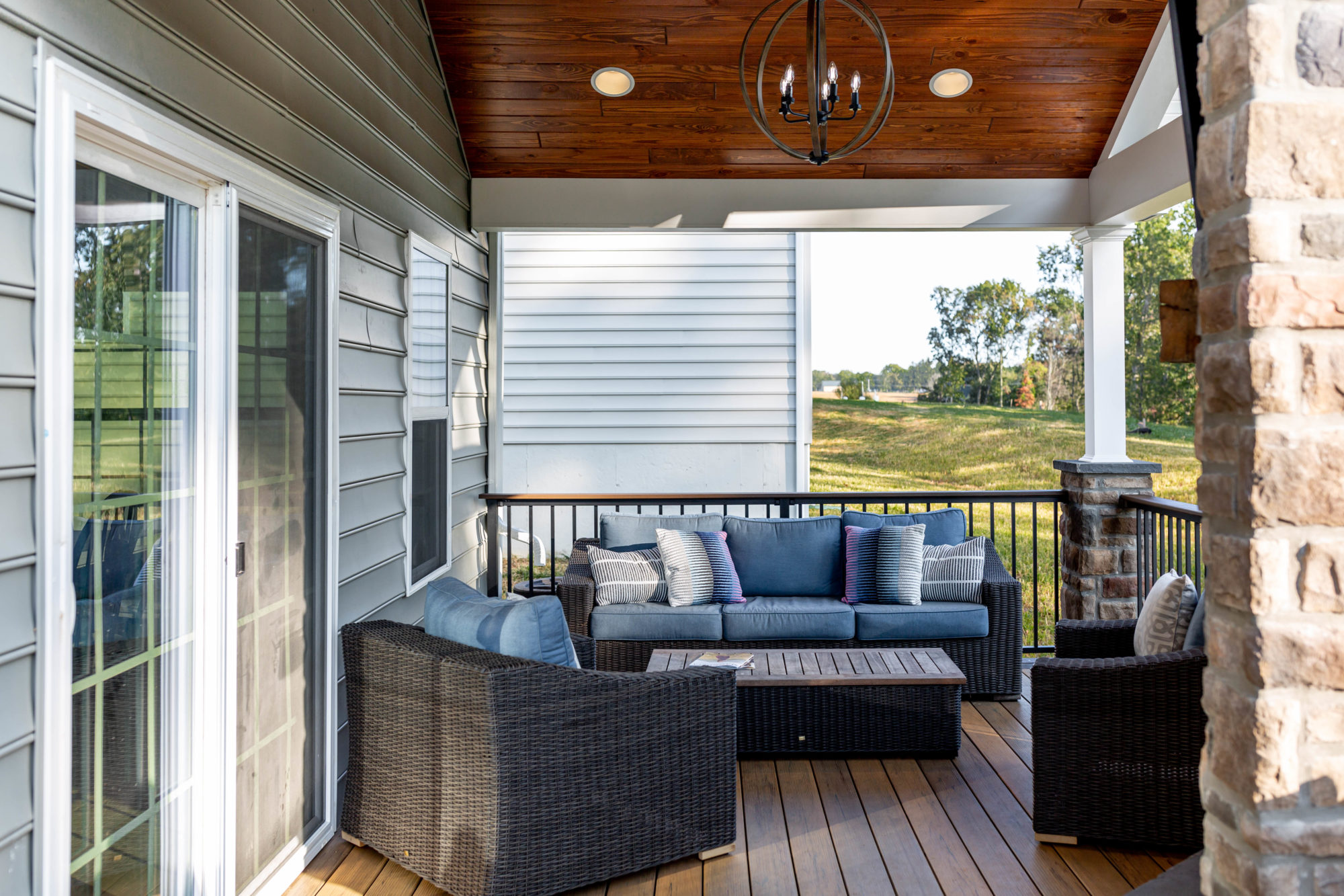 Composite deck with covered porch area Integrous Fences and Decks