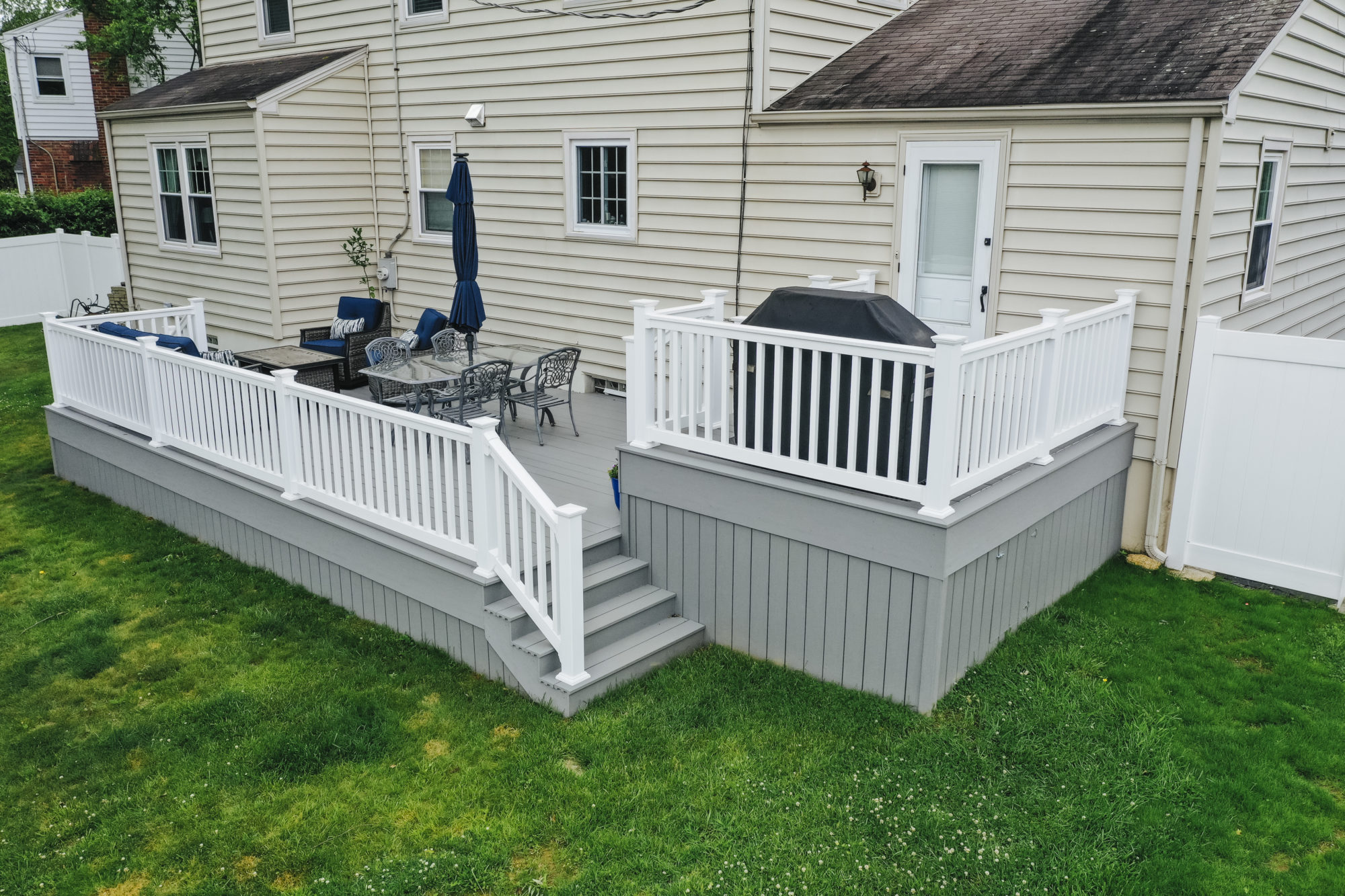 Multi level deck TimberTech deck with White Vinyl Railing