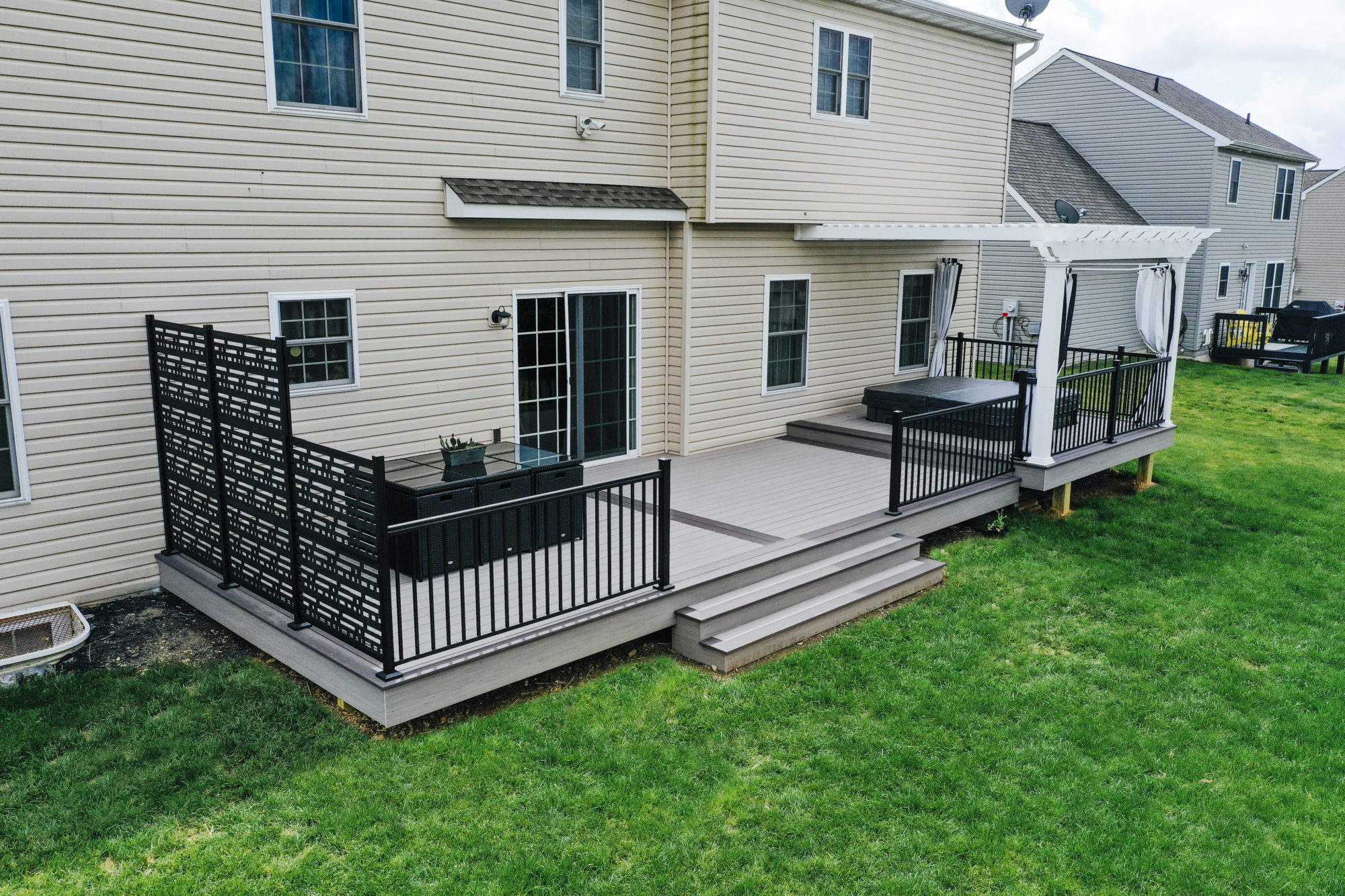 Azek deck with White Pergola Covering hot tub area