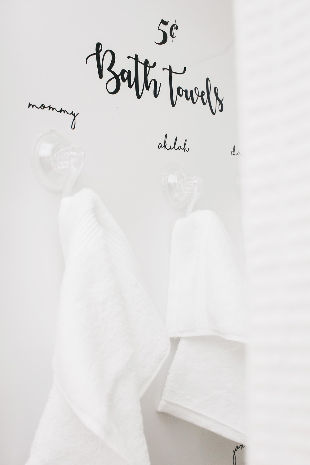 New Year Organization Idea Bathroom Towel Display With Window Clings Created With Cricut · DIY
