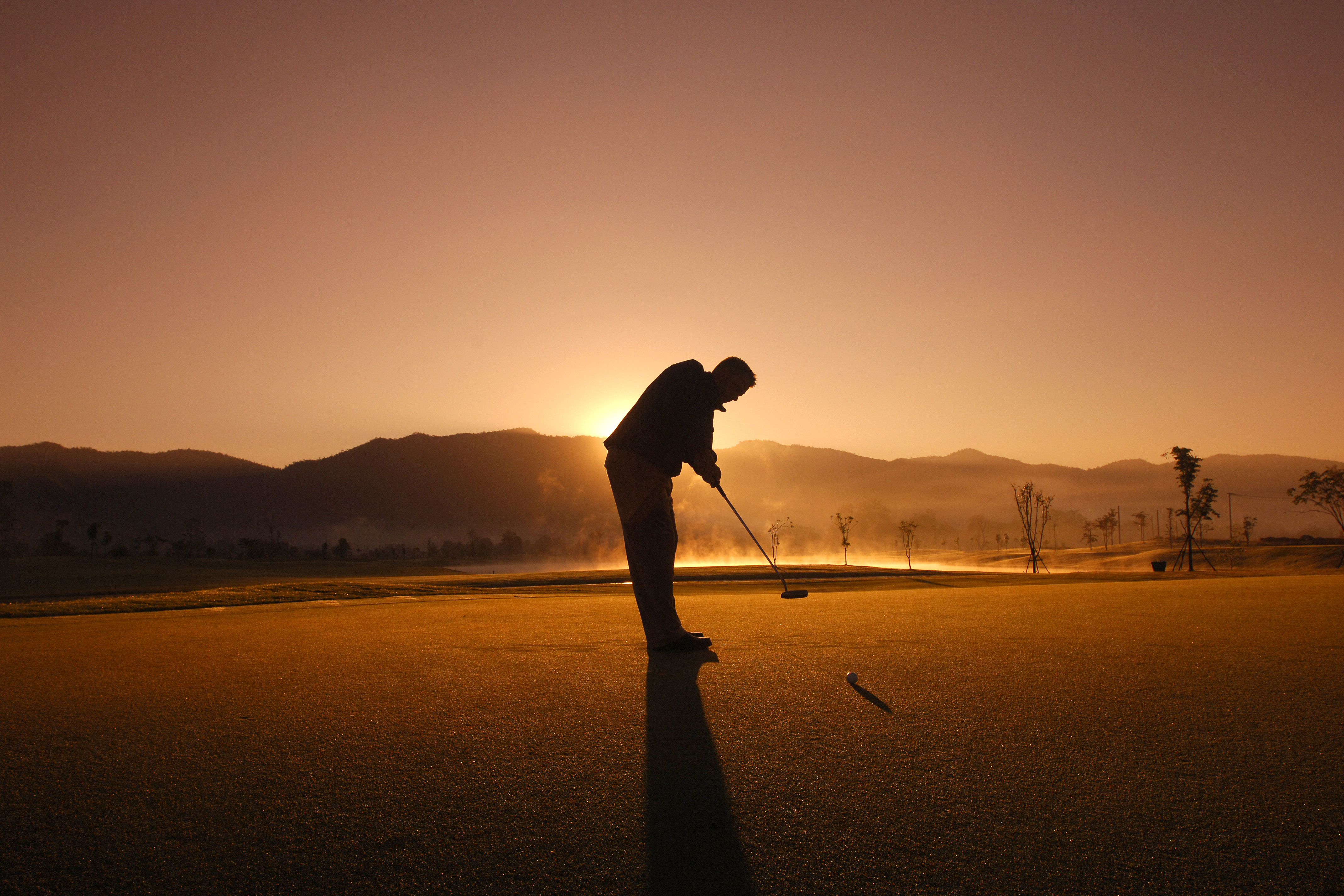 Man Playing Golf RoyaltyFree Stock Photo and Image