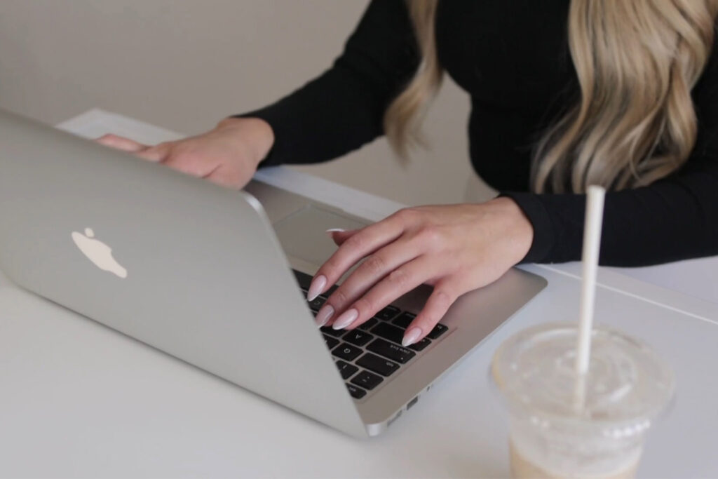 Woman's Hands Using Laptop